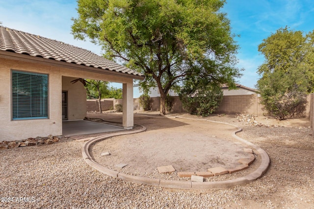 view of yard with a patio and a fenced backyard