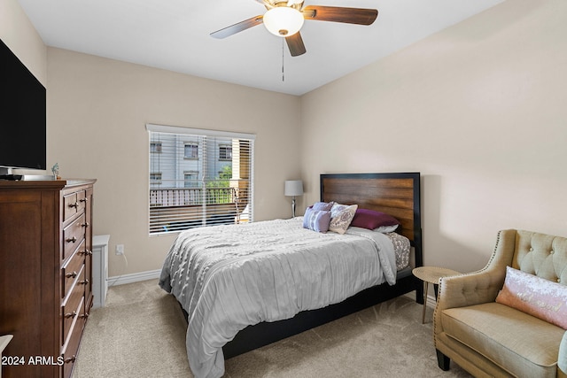 bedroom featuring ceiling fan and light colored carpet