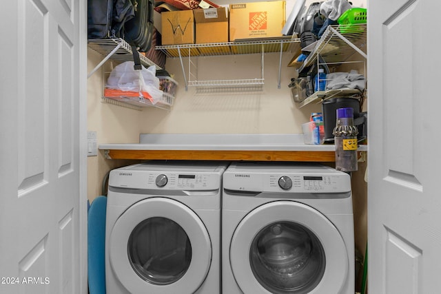 laundry area featuring washing machine and clothes dryer