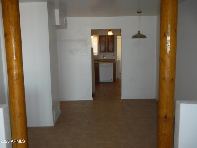 hallway with tile patterned floors and visible vents