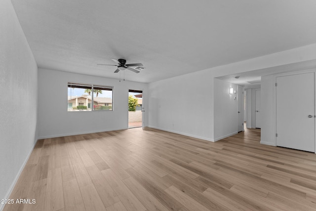 spare room with ceiling fan and light hardwood / wood-style floors