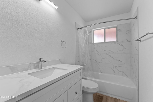 full bathroom with vanity, toilet, wood-type flooring, and shower / bath combo