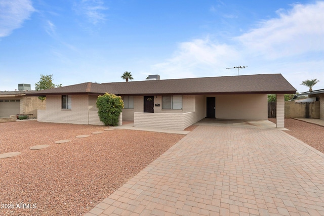 single story home with a carport