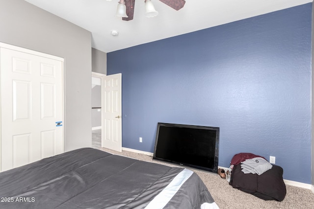 unfurnished bedroom featuring ceiling fan, carpet flooring, and baseboards