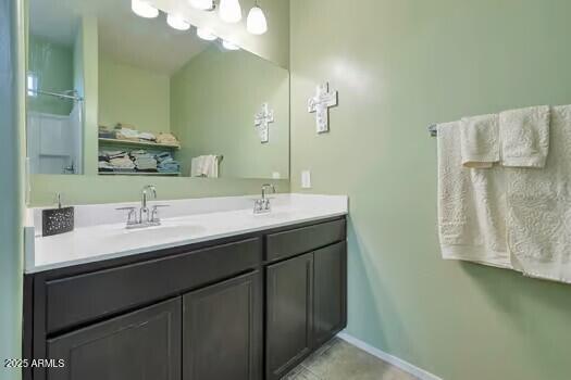 bathroom with tile patterned flooring and vanity