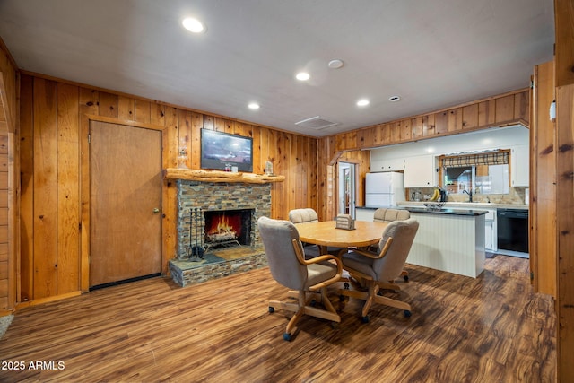3384 Turkey Run, Overgaard, AZ 85933 - dining room featuring wood walls, a fireplace, recessed lighting, and wood finished floors