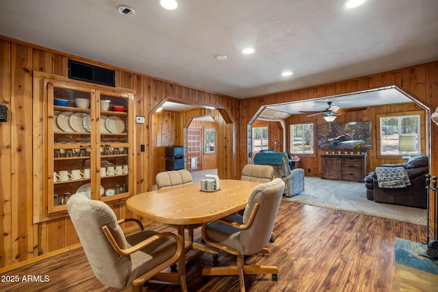 3384 Turkey Run, Overgaard, AZ 85933 - dining space with wood walls, recessed lighting, wood finished floors, a ceiling fan, and arched walkways