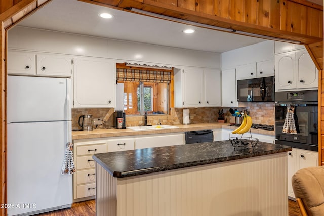 3384 Turkey Run, Overgaard, AZ 85933 - kitchen with black appliances, a sink, decorative backsplash, white cabinetry, and recessed lighting