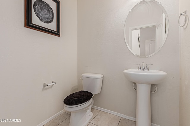 bathroom featuring toilet and tile patterned floors