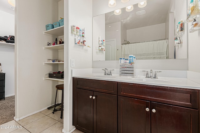 bathroom featuring vanity, a shower with curtain, and tile patterned flooring