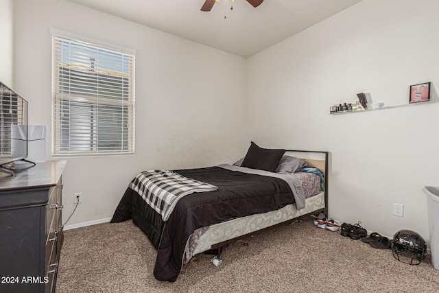 carpeted bedroom featuring ceiling fan