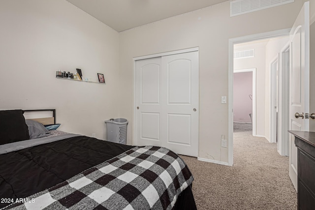 carpeted bedroom with a closet