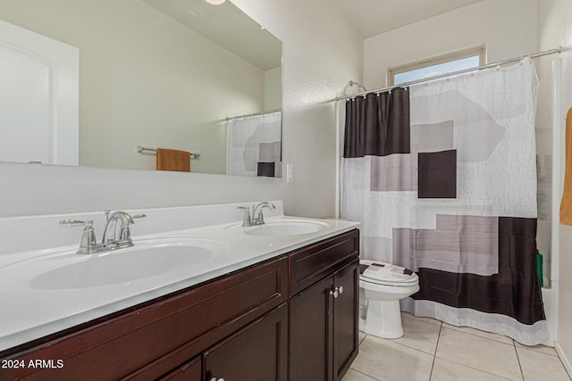 full bathroom featuring vanity, shower / bath combo with shower curtain, toilet, and tile patterned flooring