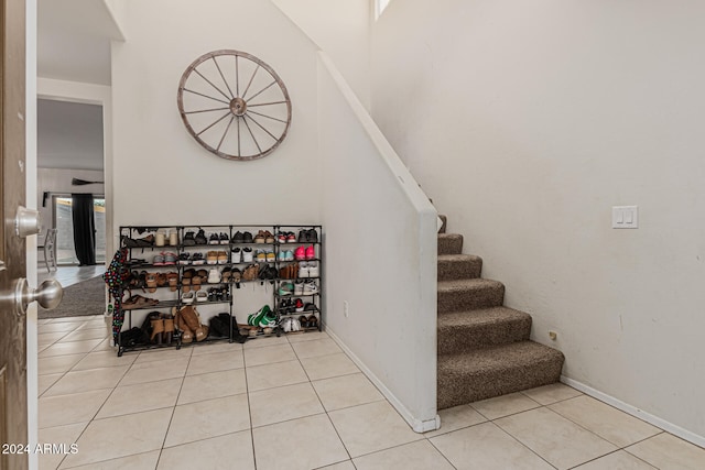 staircase featuring tile patterned floors