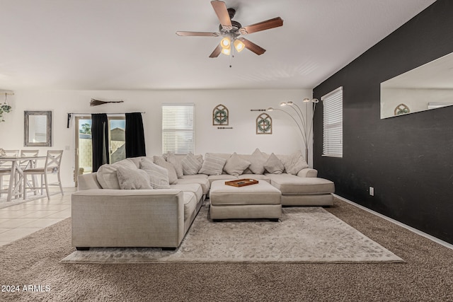 living room featuring light tile patterned flooring and ceiling fan