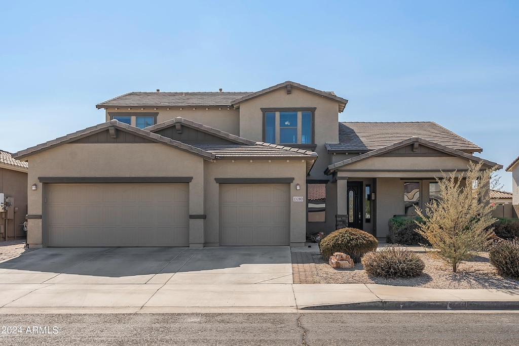 front of property with a garage