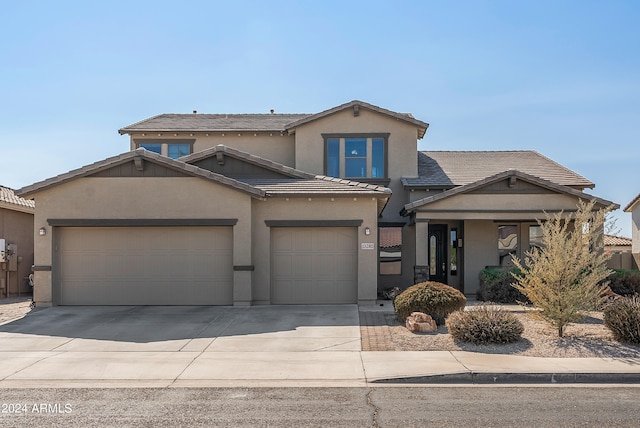 front of property with a garage