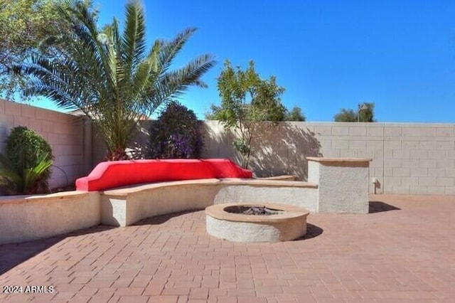 view of patio / terrace featuring a fire pit