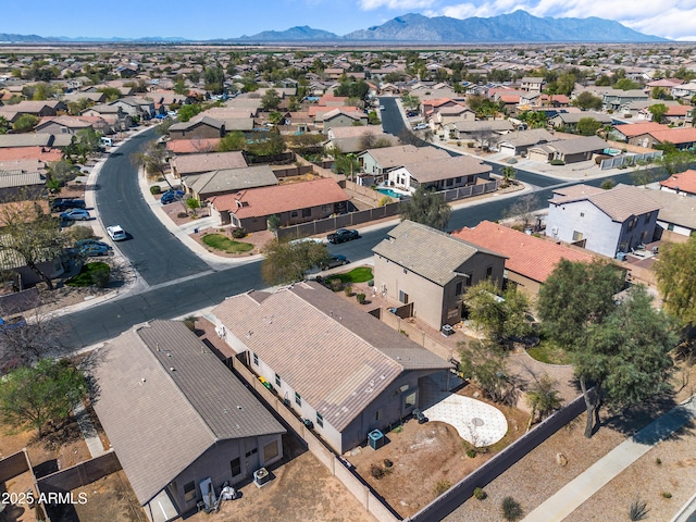 drone / aerial view featuring a mountain view and a residential view