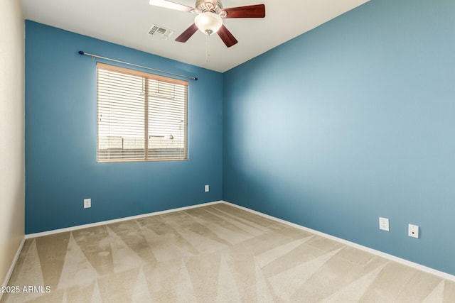 carpeted empty room featuring ceiling fan