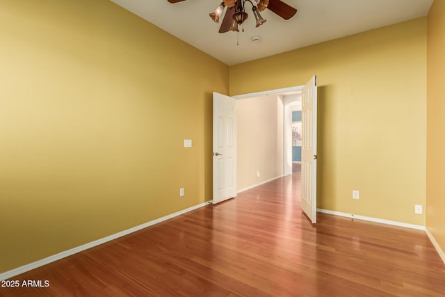 spare room featuring ceiling fan and light hardwood / wood-style floors