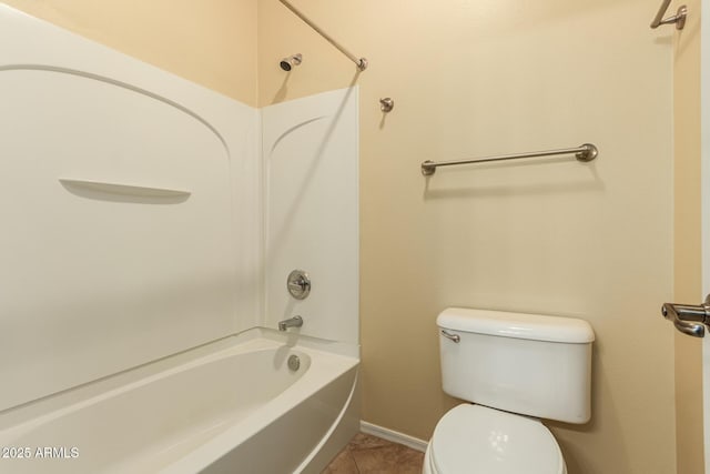 bathroom featuring toilet, shower / washtub combination, and tile patterned flooring