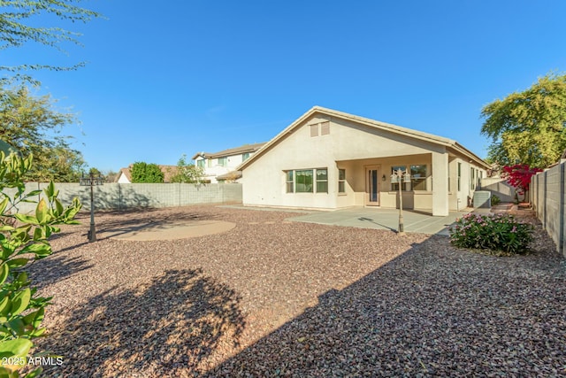 rear view of house featuring a patio