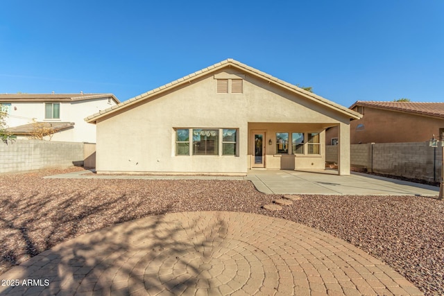 back of house featuring a patio