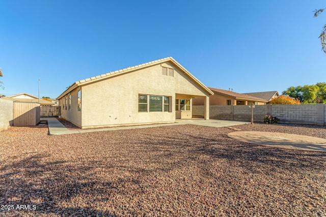 rear view of house with a patio area