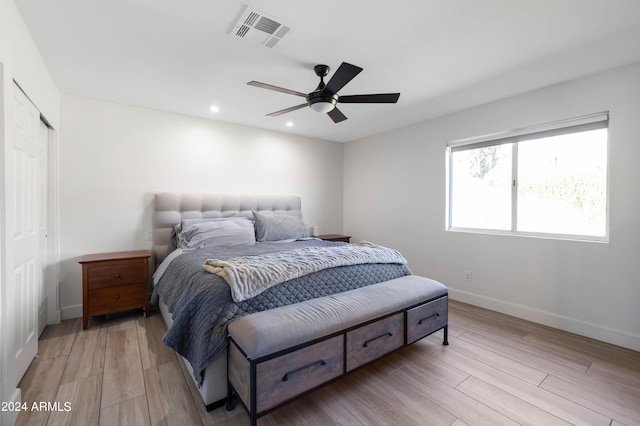 bedroom with light wood-type flooring, visible vents, baseboards, and recessed lighting