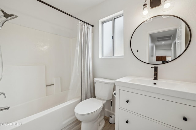 bathroom with wood finished floors, shower / bathtub combination with curtain, toilet, and vanity