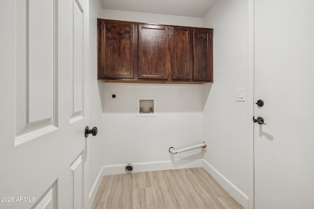 laundry area featuring cabinet space, baseboards, gas dryer hookup, hookup for an electric dryer, and washer hookup