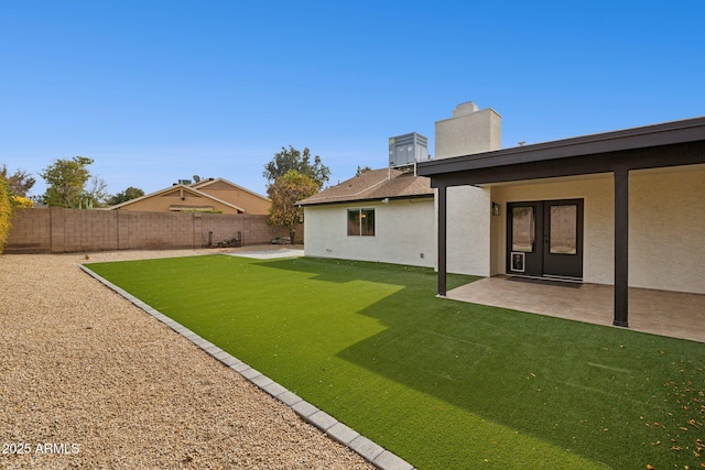 view of yard with a patio area and a fenced backyard