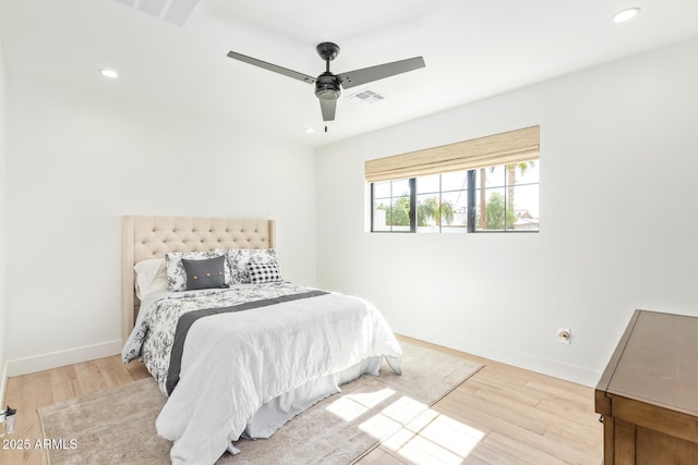bedroom featuring recessed lighting, wood finished floors, and baseboards