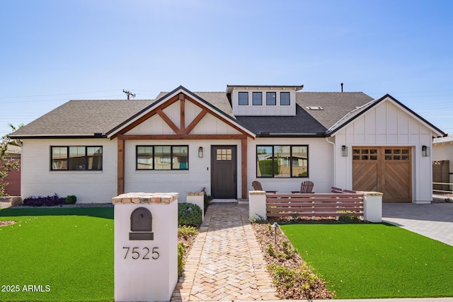 view of front of home with a garage, decorative driveway, board and batten siding, and a shingled roof