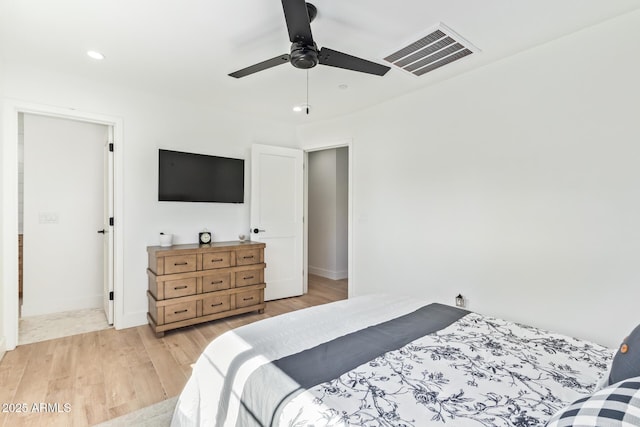 bedroom featuring baseboards, visible vents, a ceiling fan, light wood-style flooring, and recessed lighting