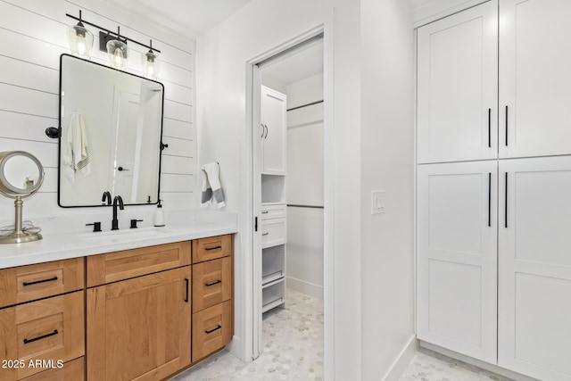 bathroom featuring baseboards and vanity