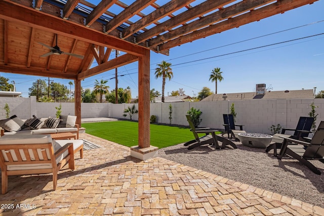view of patio / terrace featuring an outdoor fire pit, a fenced backyard, a ceiling fan, and a pergola