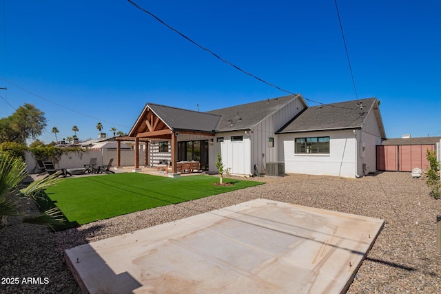 rear view of property featuring a patio area, a fenced backyard, and central air condition unit