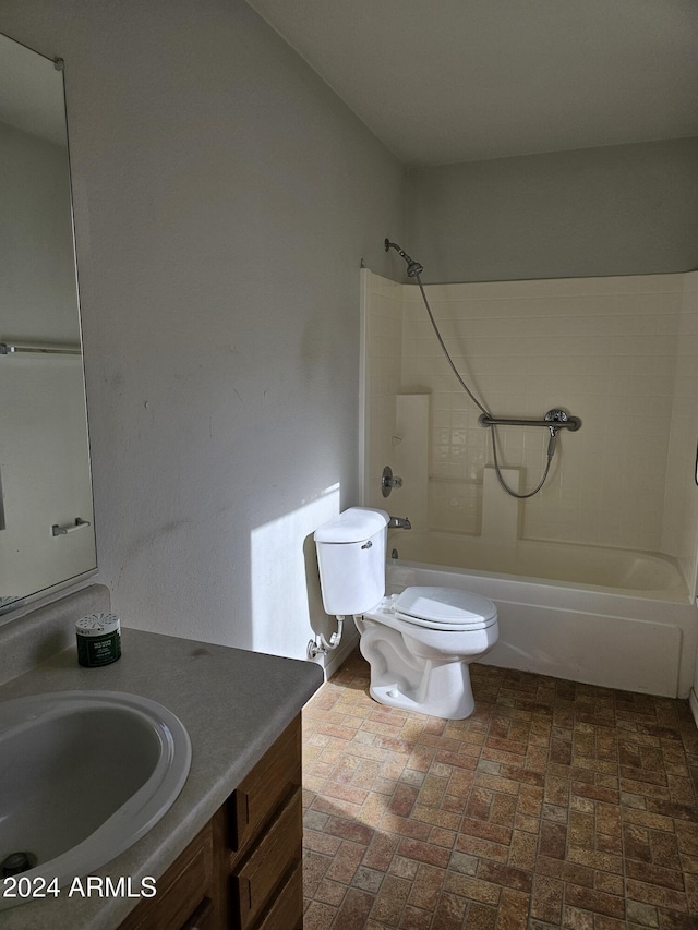 full bathroom featuring bathtub / shower combination, vanity, and toilet