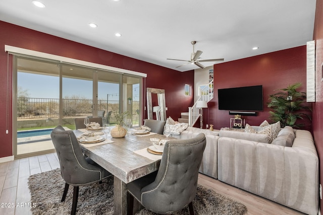 dining room with ceiling fan and light wood-type flooring