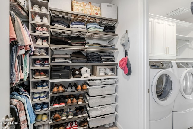 clothes washing area featuring washing machine and clothes dryer