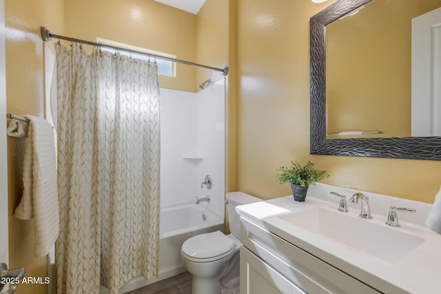 full bathroom with vanity, shower / bath combo, and toilet