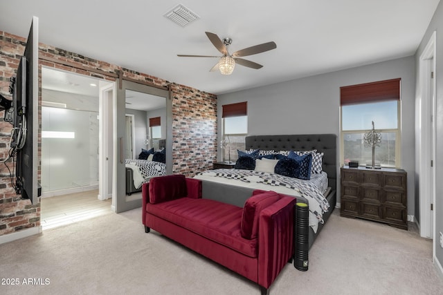 bedroom featuring brick wall, light carpet, and ceiling fan