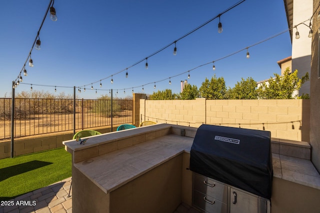 view of patio featuring a grill and exterior kitchen