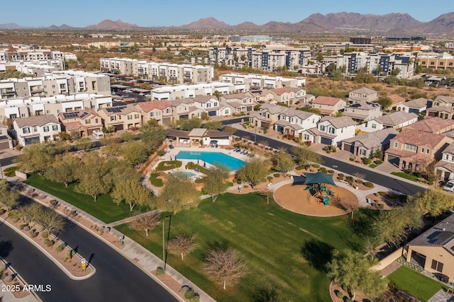 birds eye view of property with a mountain view