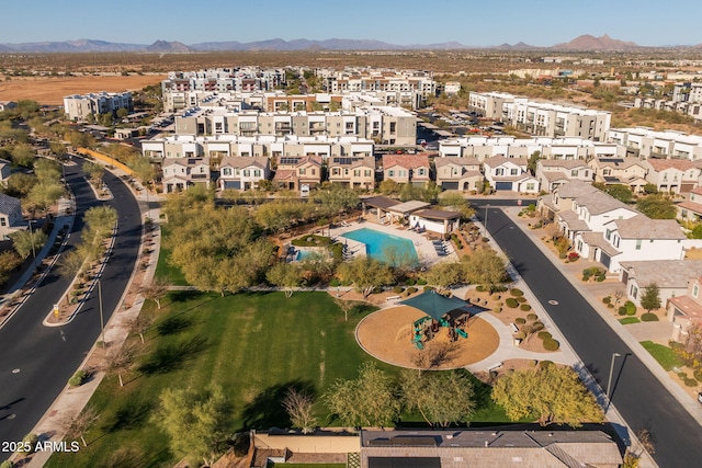 birds eye view of property with a mountain view