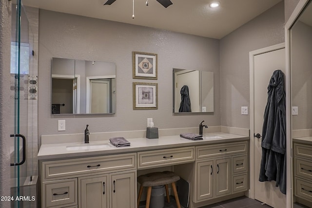 bathroom with vanity, tile patterned flooring, a shower with shower door, and ceiling fan