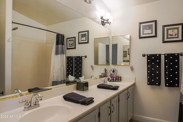 bathroom featuring vanity, vaulted ceiling, and walk in shower