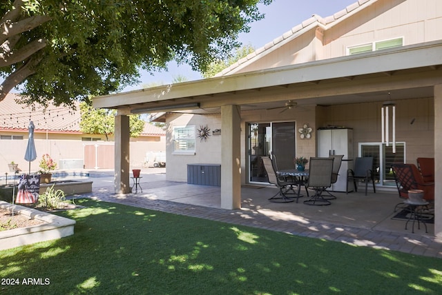 view of patio featuring ceiling fan